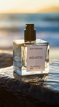 Perfume bottle labeled 'Aquatic' by Bulk Perfumes on a reflective surface with a blurred natural background